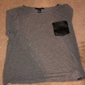 flowy gray top with leather pocket